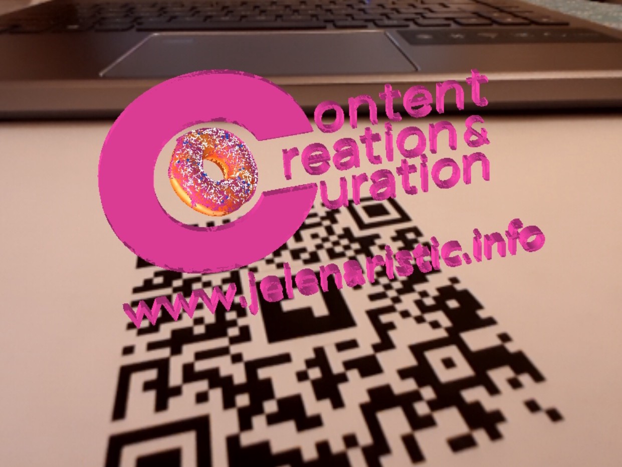 pink 3D logo with a donut hovering above a qr code printed on paper